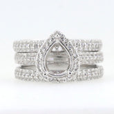 3 piece sterling silver semi mount ring setting with pear shaped design and moissanite accents.